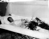 Woman laid in a coffin in her home