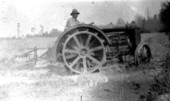Wilburn Cathledge driving a tractor - Madison, Florida.