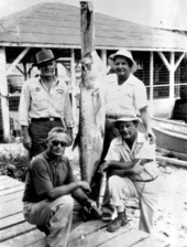 Four Madison County men with a tarpon
