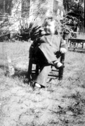 Little 3-year old Frances Mickler (Sanders) relaxing outdoors - Madison County, Florida