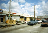 Street scene showing sign pointing to location of the medical center for first aid following Hurricane Andrew in Homestead, Florida.