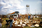 View of victims looking through boxes of aid following Hurricane Andrew in Dade County, Florida.