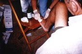 Hurricane Andrew victim receiving aid inside a tent city set up in Dade County, Florida.