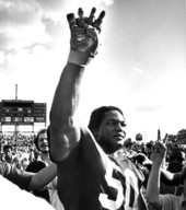 Ron Simmons stands proudly on the football field with fans - Tallahassee, Florida