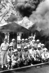 Student firefighters gathered together during a live fire controlled burn in Tallahassee.