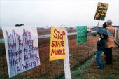 Death penalty protestors stands outside the fence - Starke, Florida