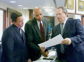 Rep. Terry Fields, center, conferring with colleagues on the House floor during the 2006 Legislature.
