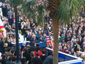 Governor Charlie Crist receiving applause at the podium during his inauguration while looking toward departing Governor Jeb Bush - Tallahassee, Florida.