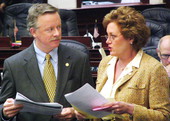 Florida State Representative Jeffrey Kottkamp, R-Cape Coral, conferring with Representative Trudi Williams, R-Fort Myers, on the House floor during the 2005 Legislature.