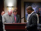 Florida State Representative James Bush III, D-Miami, leading opening prayer on the House floor during special session of the Legislature in Tallahassee, Florida.