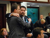 Rep. Eric Eisnaugle, left, getting hugged by Rep. Juan Carlos Planas after consideration of amendment.