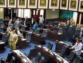 Florida State Representative Baxter Troutman, R-Winter Haven, demonstrating the cracking sound of a bull whip during "Boot Day" activities on the House floor in Tallahassee, Florida.