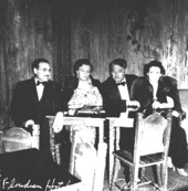 Stanley and Martha Myers sitting with Sholem and Majia Asch