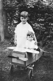 Arthur and Jack Courshon with a toy airplane