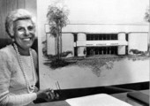 Florence Hecht holding architect drawing of the Hecht Athletic Center.