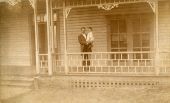 William S. Jennings holding 18-month-old son on porch of his home - Brooksville, Florida.