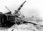 Close-up view showing Bucyrus dragline excavator at work near Lake Okeechobee.
