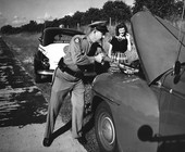 Florida Highway Patrolman F.M. Thomas putting out engine fire