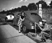 Florida Highway Patrolman L.R. Marchington changing tire