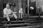 Man on steps of house