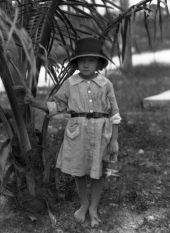 Girl under palm tree