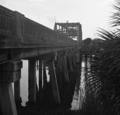 Alongside the Lake Monroe Bridge, over the Saint Johns River - border of Seminole and Volusia Counties