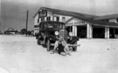 Man sitting outside the Gulf Shore Inn - Fort Myers, Florida.