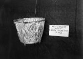 Waste basket made by FERA workers of silver palmetto leaves