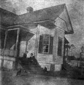 Couple on steps of home