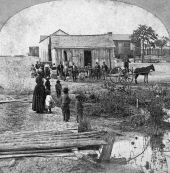 People gathered before cabin in La Villa neighborhood - Jacksonville, Florida.