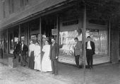 People standing on the sidewalk in front of Lee & Taylor Dry Goods store - Leesburg, Florida
