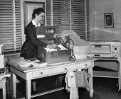 Nurse of the Leon County Health Unit with baby delivery equipment including a portable incubator