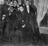Edna and Emma Pardee posing with ? in front of a piano - Micanopy, Florida