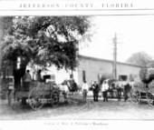 Cotton in front of Mays and Partridge warehouse