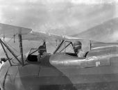 Two trainee pilots from the NYA's Camp Roosevelt in the cockpit of an airplane - Ocala, Florida.