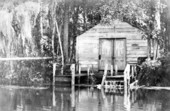 A boathouse on the river's edge