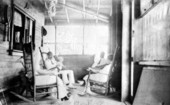 People sitting on the porch at the home of Henry Gibbons - Marathon, Florida