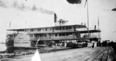 The Charles E. Cessna at Pensacola dock loading mail and supplies.
