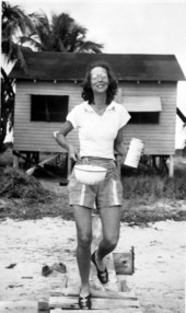 Eva Gibson with mosquito powder and pot near their cottage on Big Pine Key, Florida