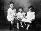 Billy Van Brunt with Clifton and Tom Byrd sitting with a book.
