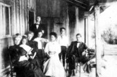 On the porch of the caretaker's house