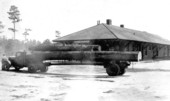 Log loaded truck at railroad depot - Zephyrhills, Florida.