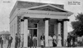 People assembled in front of bank building - Wildwood, Florida.