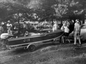 Jacksonville Outboard Motorboat Club members with a boat.