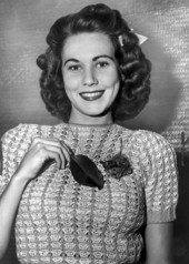 Miss Ora Bridges wearing a "leaf of life" on her sweater.
