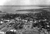 Aerial view looking over Fountain Lake and city hall toward Lake Harris - Leesburg, Florida