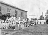 Children assembled for group portrait at Havana High School during Spring Festival day - Havana, Florida