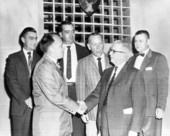 Commissioner of Agriculture Nathan Mayo meeting with men.