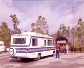 View of couple with their camper at the Walt Disney World Resort "Fort Wilderness" campground - Orlando, Florida