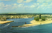 Panoramic view of beautiful Hillsboro Inlet with the famous Hillsboro Light on the right.